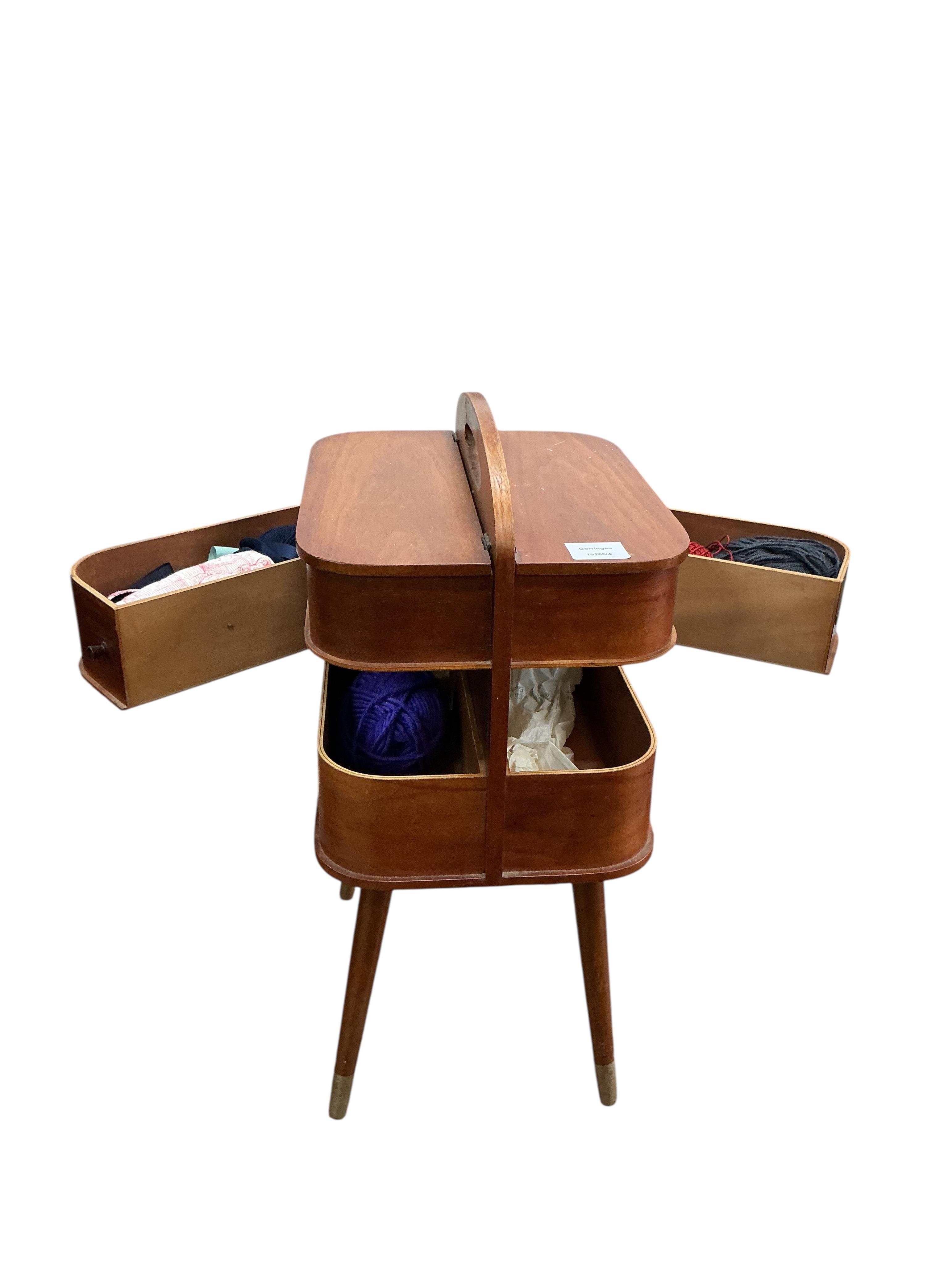 A mid century teak sewing table, width 28cm, depth 35cm, height 58cm.